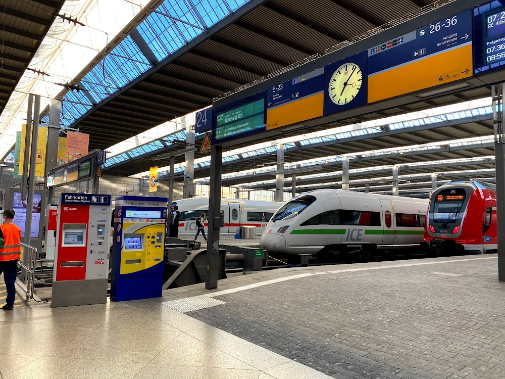 Carnival Story : train station dock in the opening scene; exterior later, as the loudspeaker announces a departure to Frankfurt