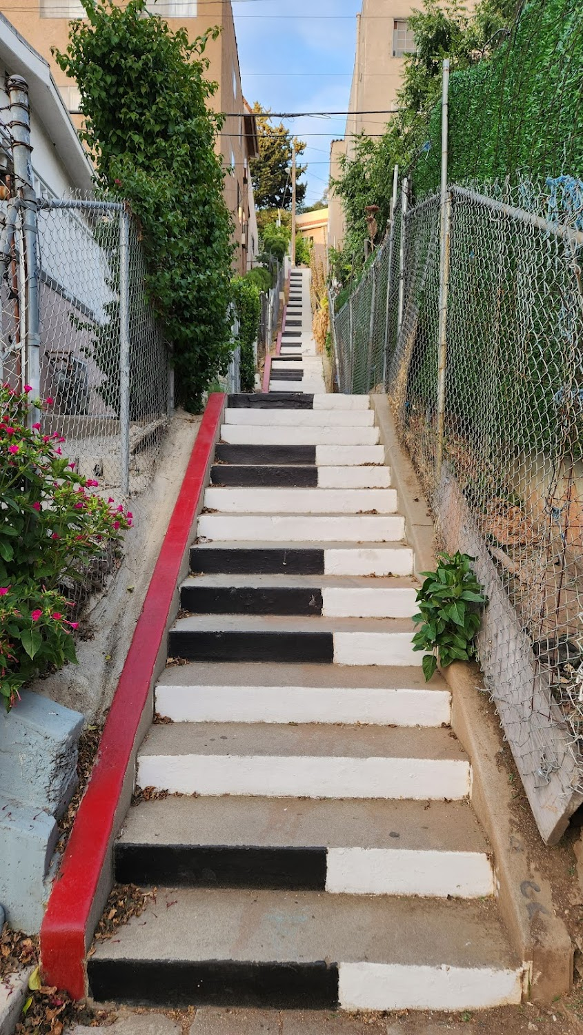 Cherry : Cherry walks past some stairs painted like a piano keyboard