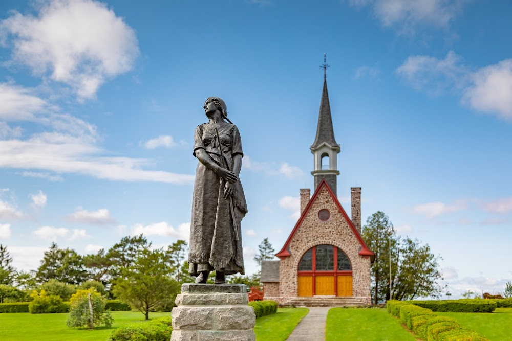 Glimpses of New Scotland : Acadian-style church fronted by a statue of Evangeline.