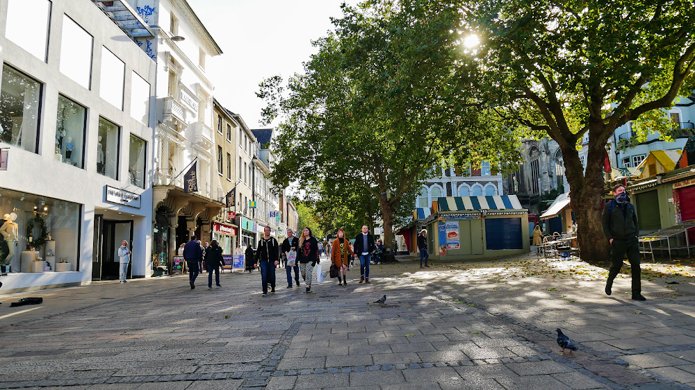 Good Luck to You, Leo Grande : Leo walking a street after the final meet; walking past Natwest and The White Company.