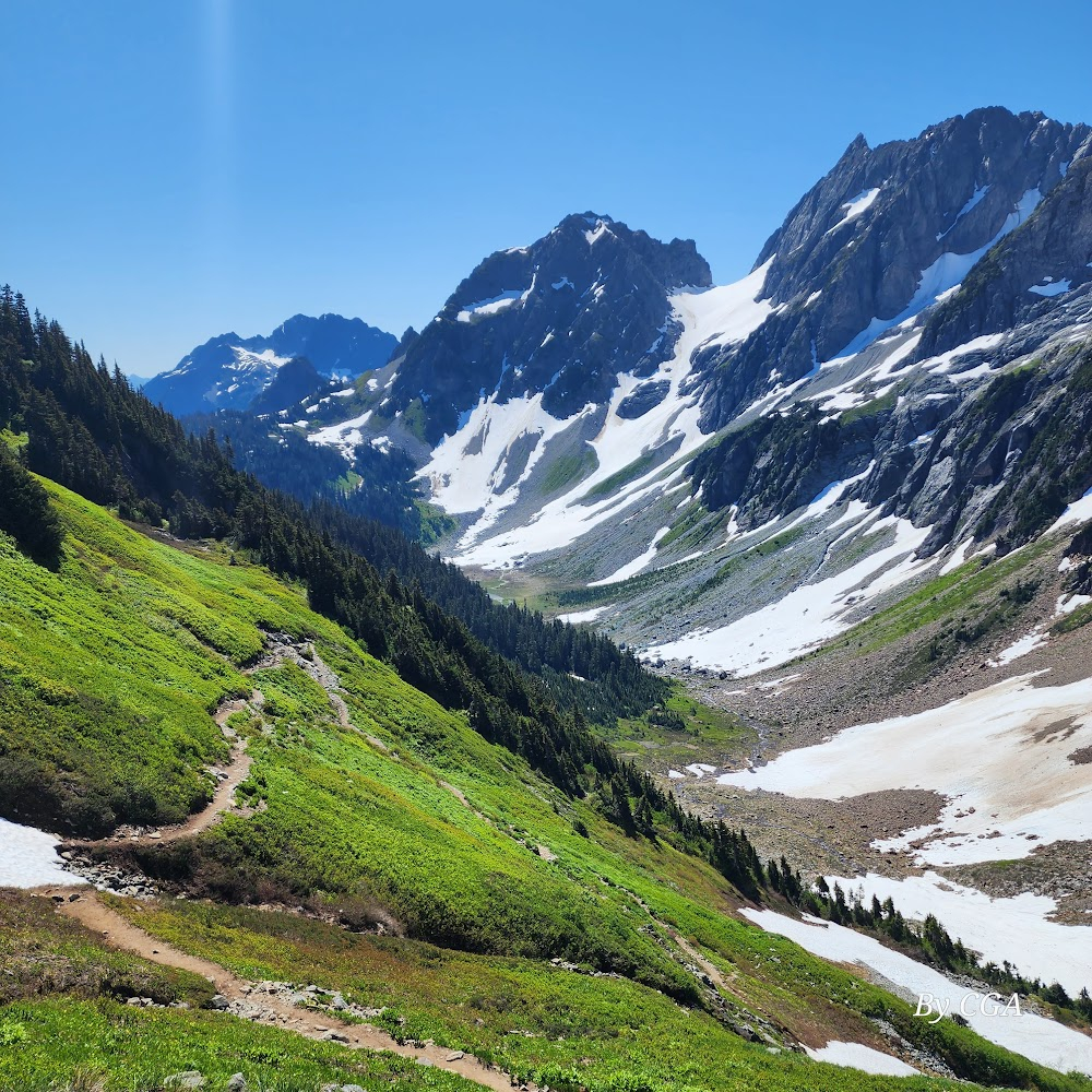 Natural Wonders of Washington State : Represented by Mount Shuksan, a peak in the North Cascades region of the state, bordering Canada.