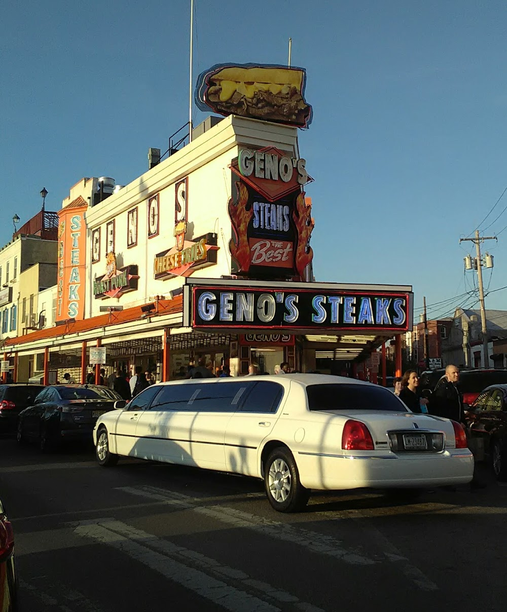 Hustle : Street basketball scene, recognizable with Geno's Steaks facade across the street