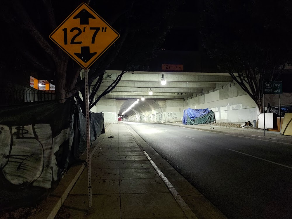 Freeway : Sunny is followed by punker in tunnel as she turns onto freeway on-ramp.