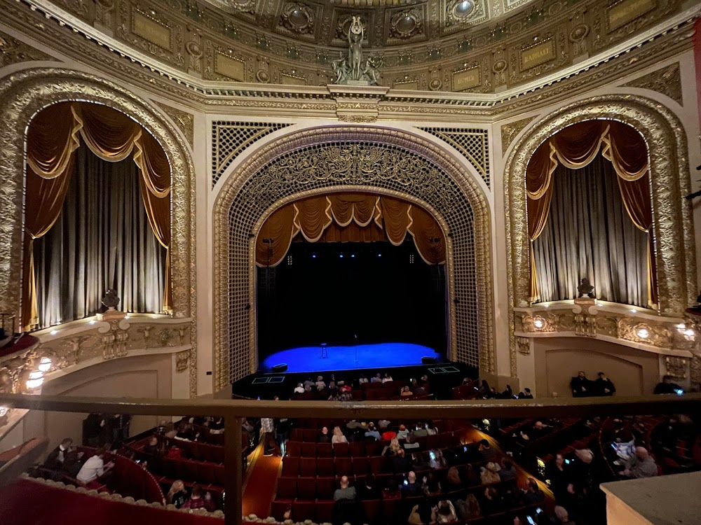 The Violinist : walking outside theater scene