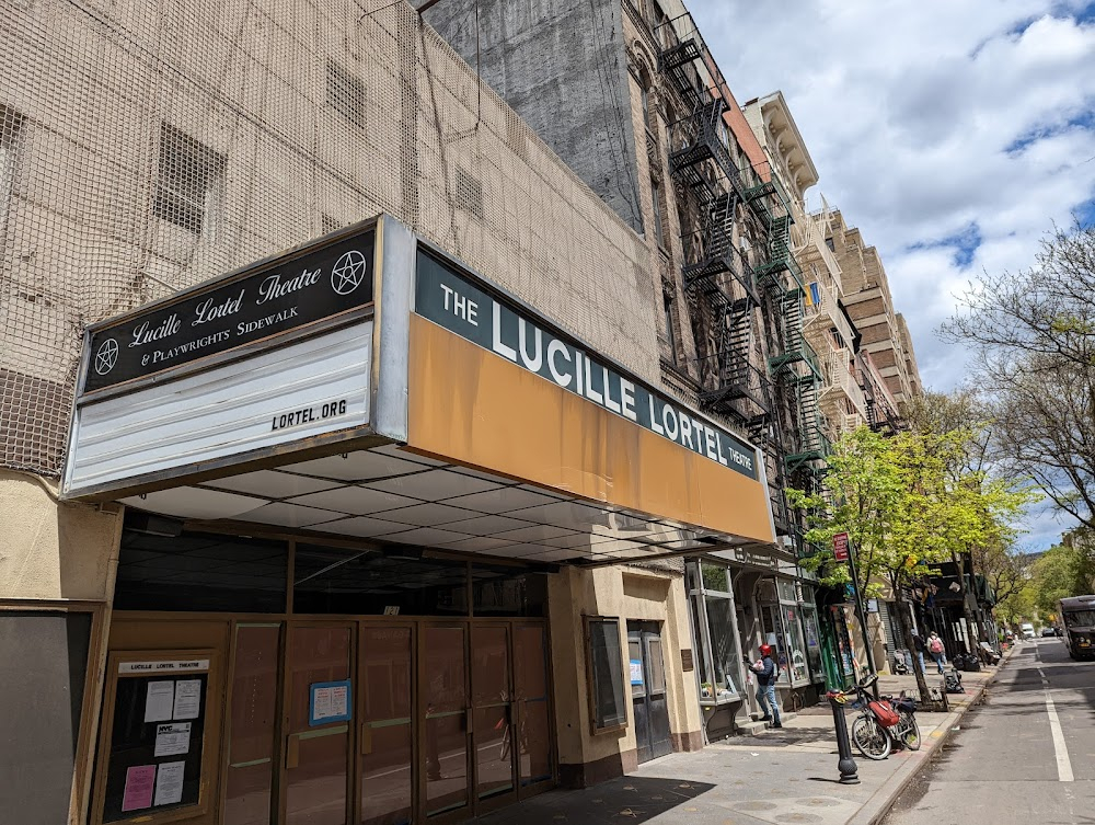 Making the Boys : Footage of a long line waiting to buy tickets in front of this theatre, with the name of the theatre prominently seen on the marquee.