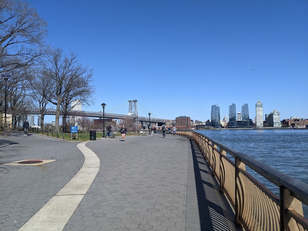 The Sleeping City : Fred meets Police Inspector Gordon at this location along the East River Promenade - Williamsburg Bridge seen in the background