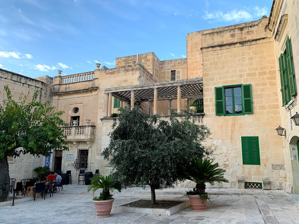 The Maltese Double Cross : View of the narrow street, and the bilingual street sign.