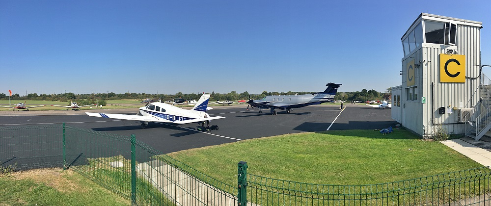 The Iron Maiden : airport scenes: the new jet aircraft takes off, flies past and lands with parachute deployed