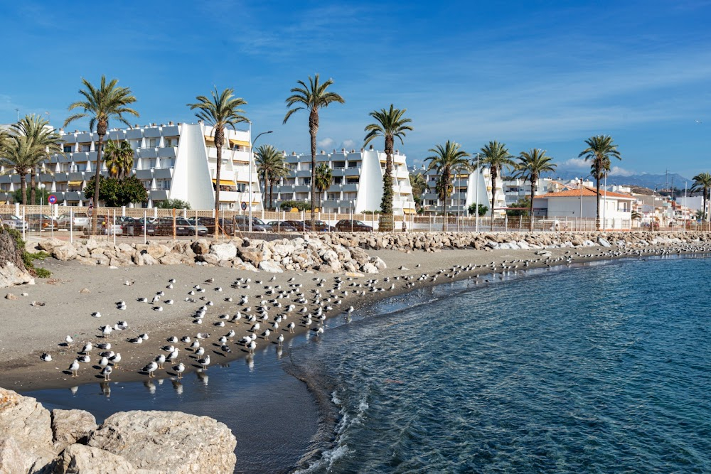 Warrior Nun : Promenade, beach and sundial in a square exterior scene