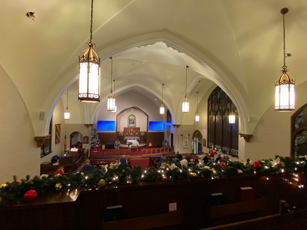 Welcome Home, Roxy Carmichael : Dinky' rides her bike past St Paul Lutheran Church